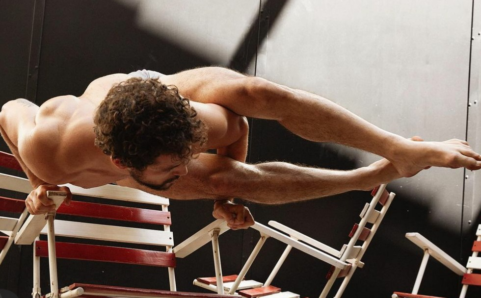 Men doing gym movement on a chair